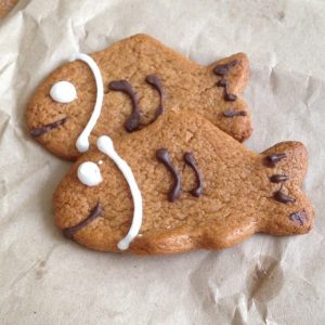 Two cookies cut into fish shapes.