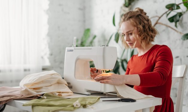 woman sitting at a sewing machine