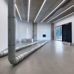metal piping and dyson vacuum cleaners in a gallery