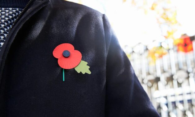 Remembrance Day poppy pinned to jacket.