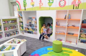 A library with children reading.