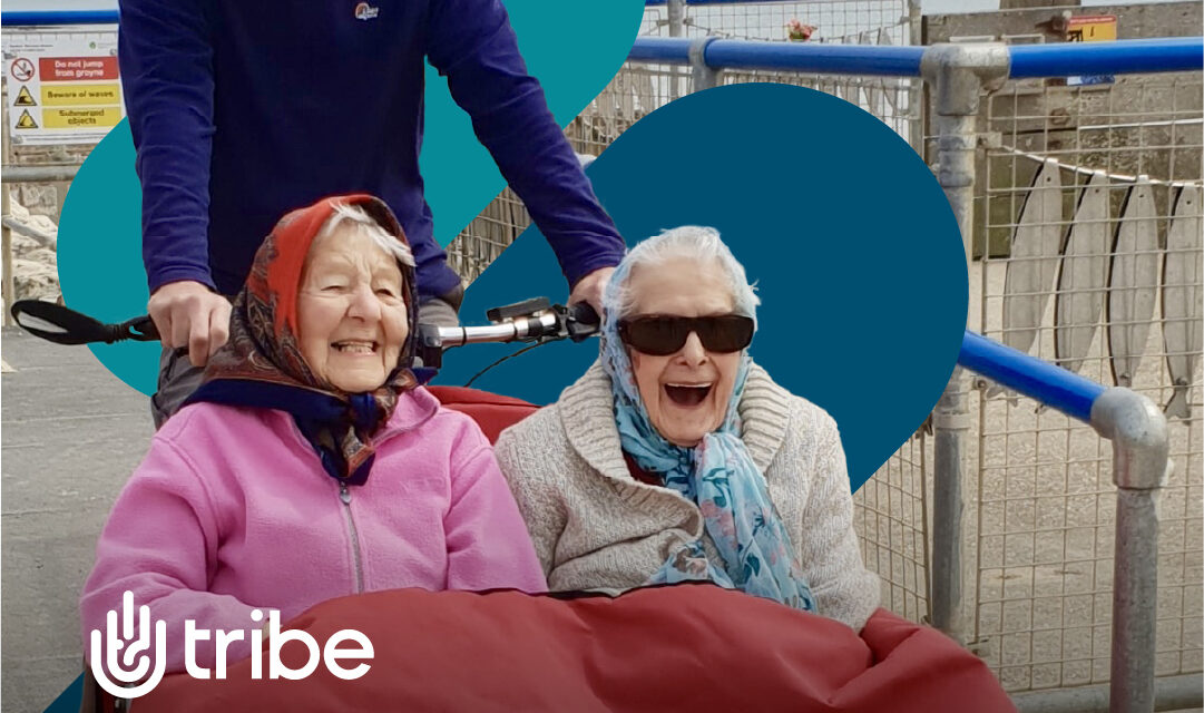 Two older women on the front of a trike