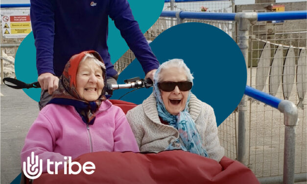 Two older women on the front of a trike