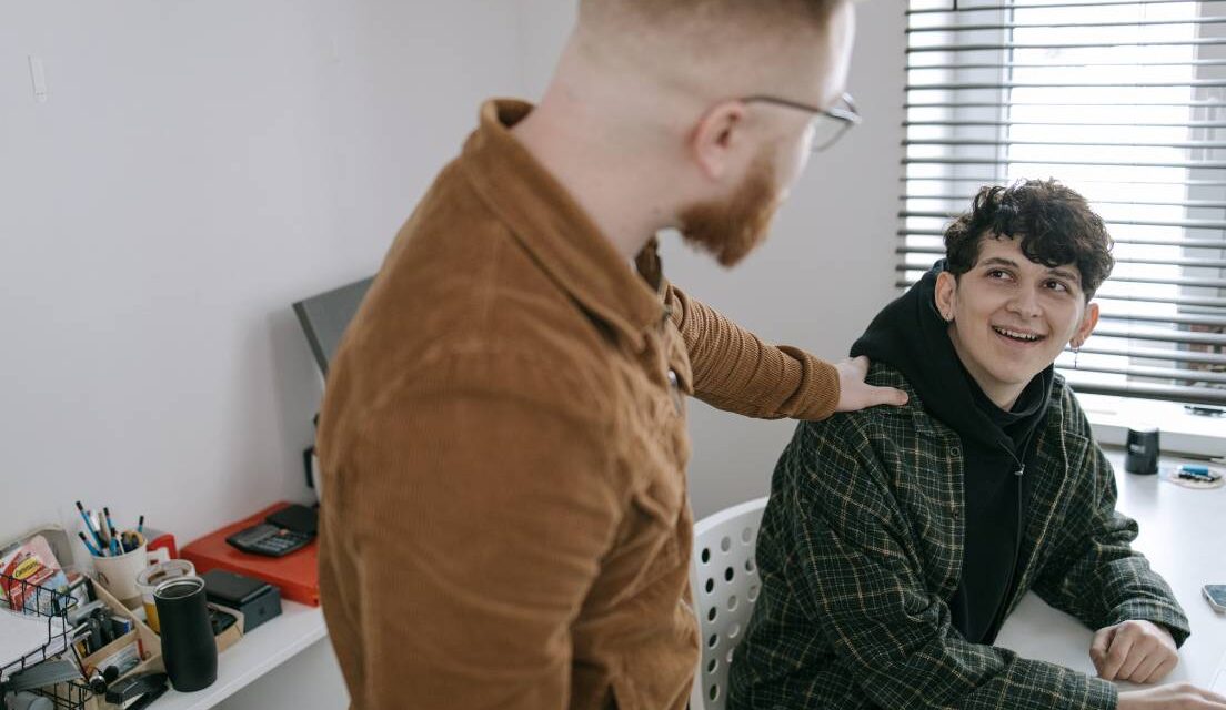 Father talking to teenage son