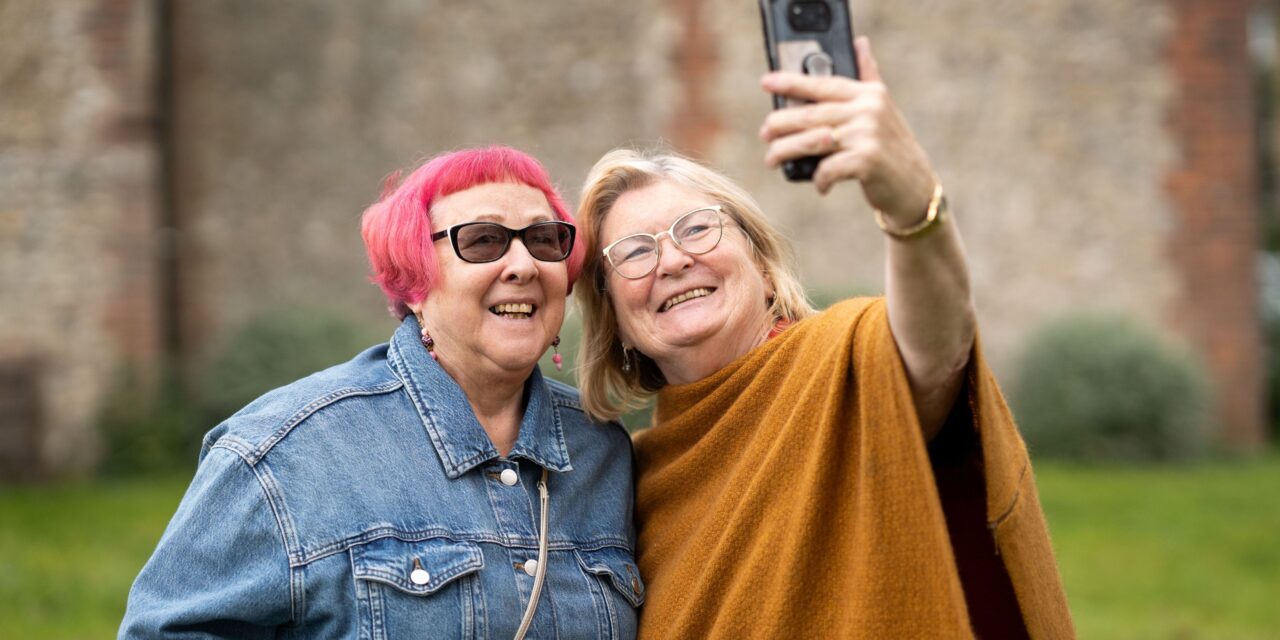 Two older friends taking a selfie