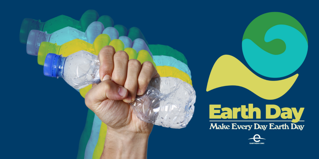 Earth Day | A hand crushes a plastic bottle