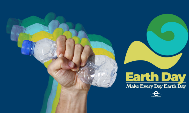 Earth Day | A hand crushes a plastic bottle