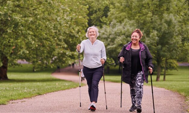 two woman walking in a park as part of their active lifestyle
