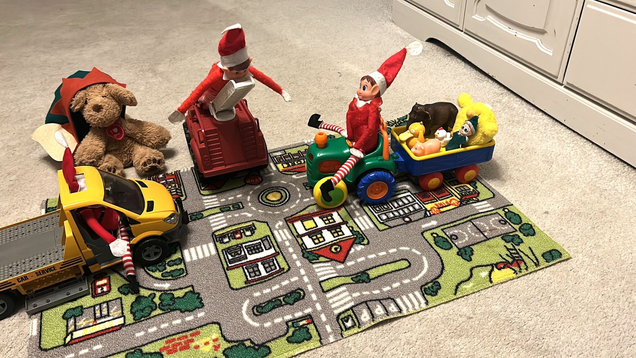 Elf on the Shelf playing cars