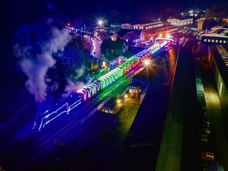 steam train lit with Christmas lights