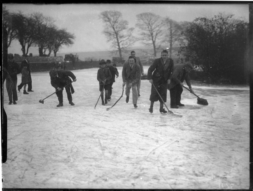 People skating on a frozen Falmer pondin East Sussex