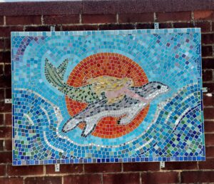 Pells pool mosaic of a mermaid swimming with a turtle