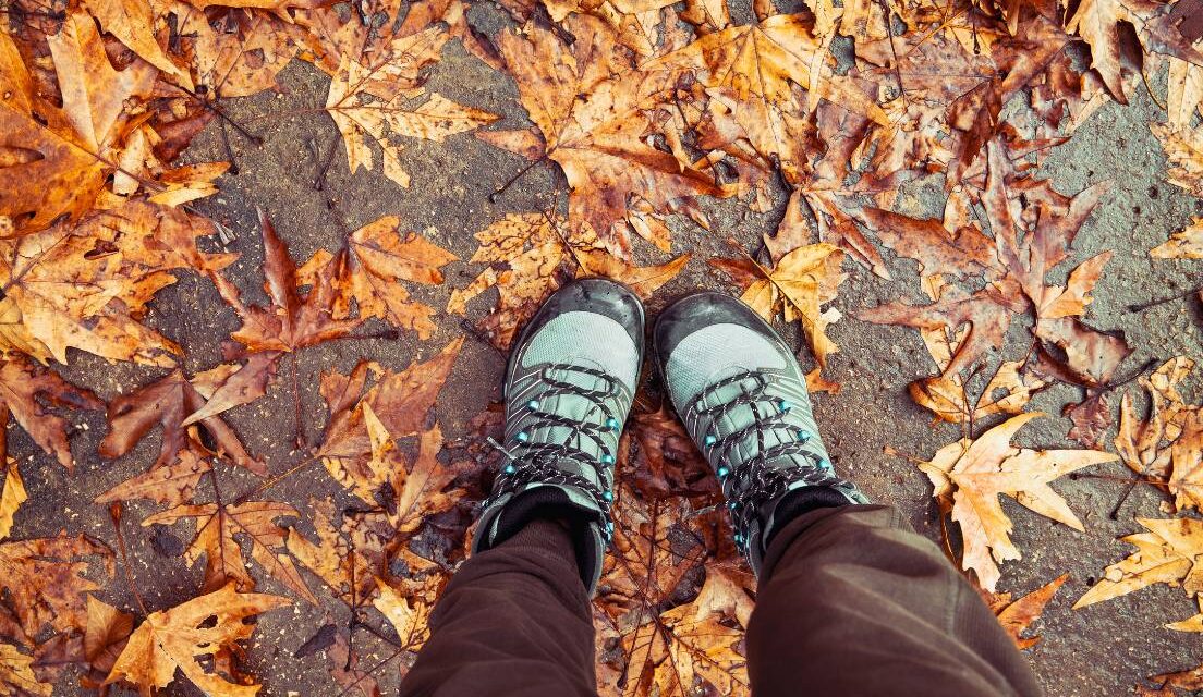 walking boots and autumn leaves